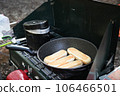 Baking bread on the gas stove in the morning at the campsite 106466501
