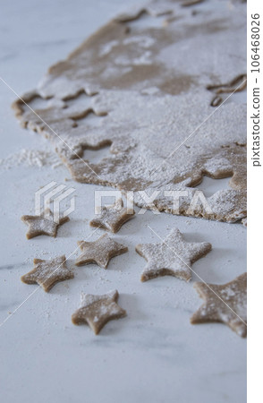 Hands of little 6 years old child with cookies in shape of star. cooking concept Hands of little 6 years old child with cookies in shape of star. cooking concept 106468026