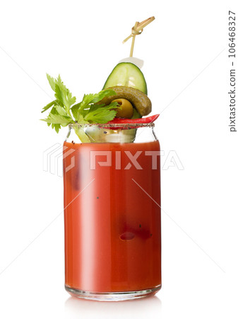 Cocktail with vodka and juice bloody mary with pickle and olive on white. Cocktail with vodka and juice bloody mary with pickle and olive on white. 106468327