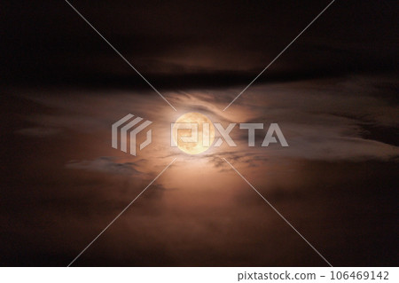 The moon seen through the gaps in the clouds The moon seen through the gaps in the clouds 106469142