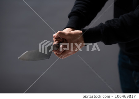 A man with a knife 106469817