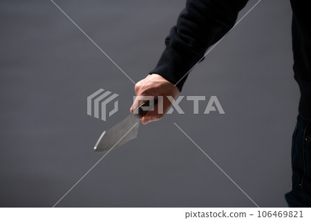 A man with a knife 106469821
