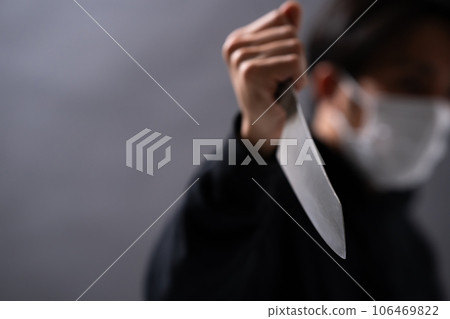 A man with a knife 106469822