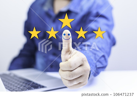 Customer service satisfaction concept. Businessman Hand with thumb up Positive emotion smiley icon. questionnaire for experience or customer satisfaction research. Five star show on virtual screen. Customer service satisfaction concept. Businessman Hand with thumb up Positive emotion smiley icon. questionnaire for experience or customer satisfaction research. Five star show on virtual screen. 106471237
