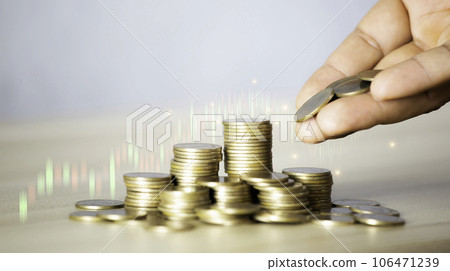 Businessman puts a coin on a pile of gold coins. Investment finance business idea. Business growing concept to success. Business success concept wealth stock investment. Technology grow concept. Businessman puts a coin on a pile of gold coins. Investment finance business idea. Business growing concept to success. Business success concept wealth stock investment. Technology grow concept. 106471239