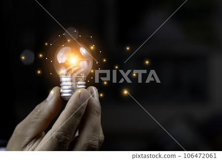 Businessman Touching Icon Bulb.Concept of Ideas for success.Concept with innovation inspiration.Success start from new ideas to innovative technology relying on information from the internet big data 106472061