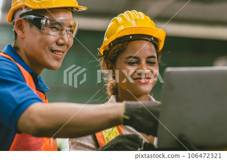 engineer team mix race man and woman working together in heavy industry with laptop computer discussion, join helping engineer teamwork. engineer team mix race man and woman working together in heavy industry with laptop computer discussion, join helping engineer teamwork. 106472321