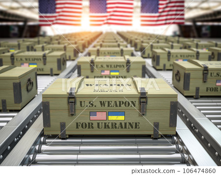 Military production, supply and delivery USA american weapon for Ukraine. Weapon box with flags of USA and Ukraine on conveyor belt. 106474860