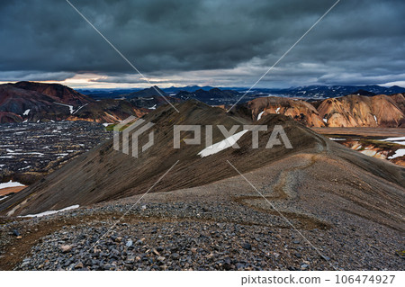 Landscape of volcanic mountain with moody sky on Blahnjukur trail among Icelandic highlands in summer Landscape of volcanic mountain with moody sky on Blahnjukur trail among Icelandic highlands in summer 106474927