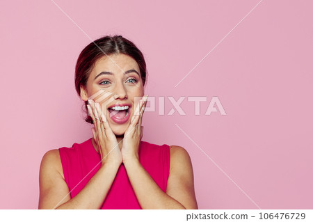 Cheerful woman with open mouth on colorful pink background 106476729