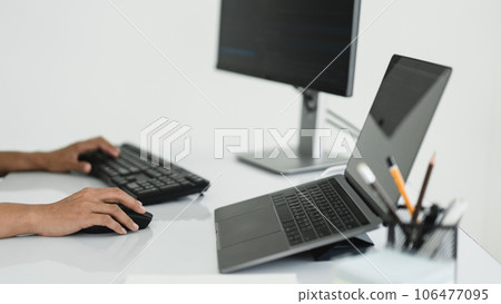 Hands of developer programmer using mouse and typing on keyboard to programming and developing web Hands of developer programmer using mouse and typing on keyboard to programming and developing web 106477095