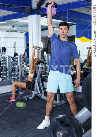 Man doing exercises with dumbbells Man doing exercises with dumbbells 106477598