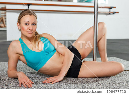 Woman on floor near pylon 106477710
