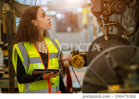 engineer smart woman african black worker check machine condition for safety service maintenance in heavy metal factory engineer smart woman african black worker check machine condition for safety service maintenance in heavy metal factory 106478368
