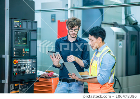 smart senior expert specialist engineer male work education training young new technician modern CNC machine operator 106478386