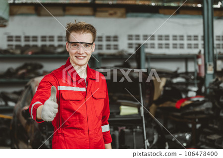 portrait thumbs up happy garage mechanic male worker working fix service maintenance auto vehicle engine 106478400