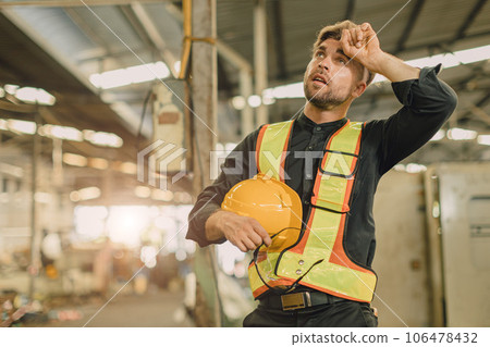 young engineer male caucasian worker tired exhausted fatigue from hard working in heavy industry machinery factory young engineer male caucasian worker tired exhausted fatigue from hard working in heavy industry machinery factory 106478432