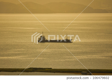 Golden sea and fishing boats at sunset Golden sea and fishing boats at sunset 106479602