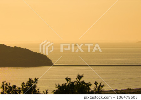 Golden sea and fishing boats at sunset Golden sea and fishing boats at sunset 106479603