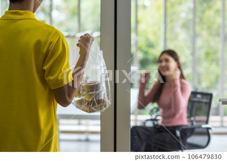 courier man in uniform deliver cake to happy office woman courier man in uniform deliver cake to happy office woman 106479830