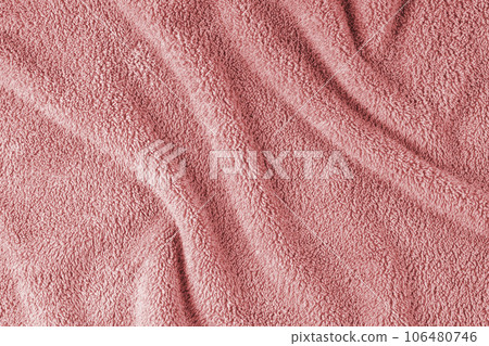 Terry cloth, red towel texture background. Soft fluffy textile bath or beach towel material Terry cloth, red towel texture background. Soft fluffy textile bath or beach towel material 106480746