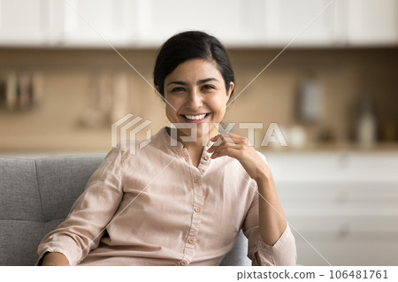 Happy beautiful young Indian woman looking at camera 106481761