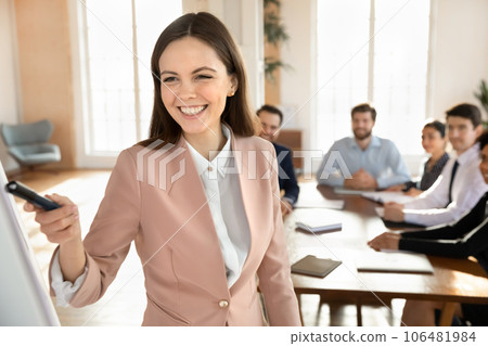 Smiling Caucasian female coach make presentation at meeting Smiling Caucasian female coach make presentation at meeting 106481984