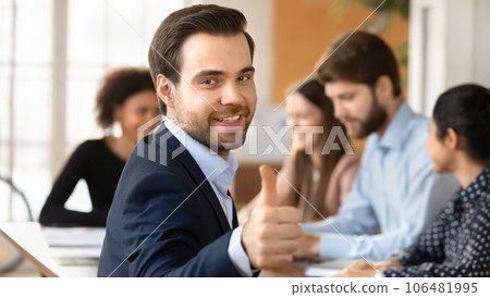 Portrait of smiling male employee recommend good service Portrait of smiling male employee recommend good service 106481995