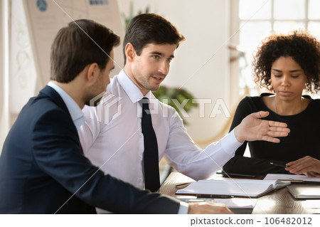 Diverse employee discuss business ideas at office briefing 106482012
