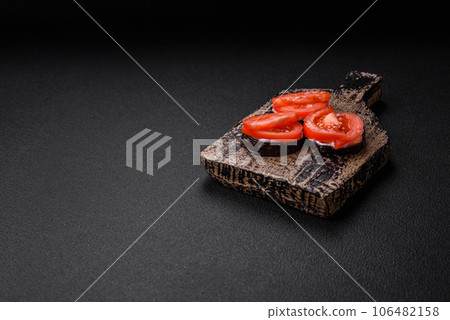 Delicious eggplant cut into circles grilled and cooked with mayonnaise and tomatoes 106482158