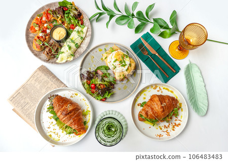 Set of breakfast dishes: croissants, toast, scrambled eggs, salad, bruschetta Set of breakfast dishes: croissants, toast, scrambled eggs, salad, bruschetta 106483483