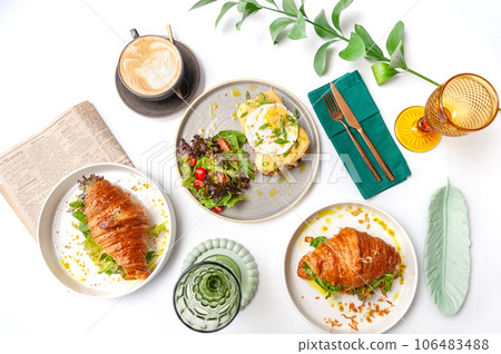Set of breakfast dishes: croissants, toast, scrambled eggs, salad, bruschetta Set of breakfast dishes: croissants, toast, scrambled eggs, salad, bruschetta 106483488