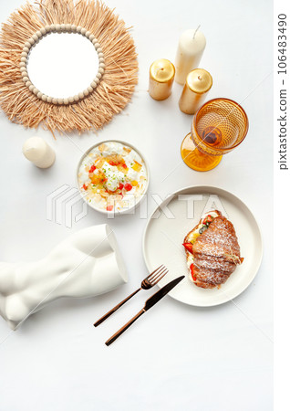 Delicious breakfast with fresh croissants and ripe berries on the white table 106483490