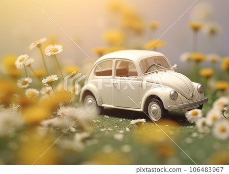 A small blue childrens car stands on an autumn yellow background and beautiful white daisies are on it 106483967