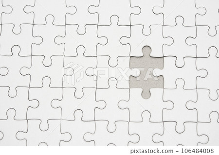 White jigsaw puzzle pattern background. placing last piece of jigsaw puzzle White jigsaw puzzle pattern background. placing last piece of jigsaw puzzle 106484008