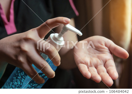 Woman using alcohol gel for cleaning hands prevention of coronavirus virus outbreak. Woman using alcohol gel for cleaning hands prevention of coronavirus virus outbreak. 106484042