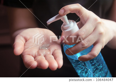 Woman using alcohol gel for cleaning hands prevention of coronavirus virus outbreak. Woman using alcohol gel for cleaning hands prevention of coronavirus virus outbreak. 106484047