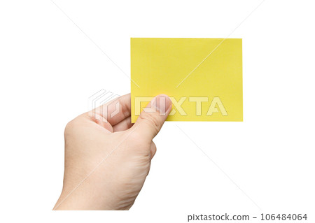Hand holding yellow paper isolated on white with clipping path. Hand holding yellow paper isolated on white with clipping path. 106484064