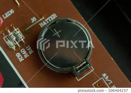 Lithium Battery Coin On Electronic circuit. 106484237
