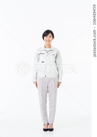 Young woman in work clothes Young woman in work clothes 106489459