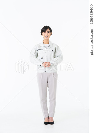 Young woman in work clothes Young woman in work clothes 106489460