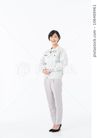 Young woman in work clothes Young woman in work clothes 106489461
