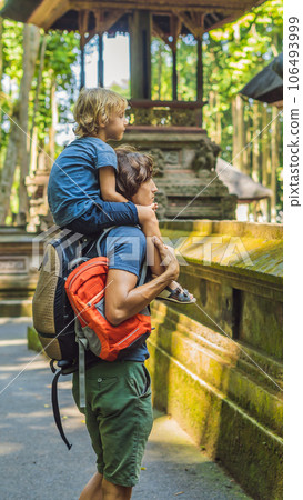 Dad and son travelers discovering Ubud forest in Monkey forest, Bali Indonesia. Traveling with children concept VERTICAL FORMAT for Instagram mobile story or stories size. Mobile wallpaper 106493999