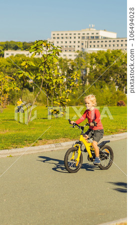 Two happy boys cycling in the park VERTICAL FORMAT for Instagram mobile story or stories size. Mobile wallpaper Two happy boys cycling in the park VERTICAL FORMAT for Instagram mobile story or stories size. Mobile wallpaper 106494028