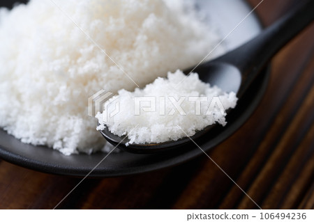 Natural salt served in a small plate 106494236