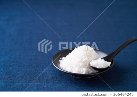 Natural salt served in a small plate 106494245