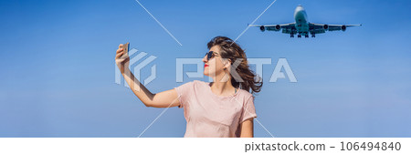 Woman makes a selfie on the beach watching the landing planes. Traveling on an airplane concept. Text space. Island Phuket in Thailand. Impressive paradise. Hot beach Mai Khao. Amazing landscape Woman makes a selfie on the beach watching the landing planes. Traveling on an airplane concept. Text space. Island Phuket in Thailand. Impressive paradise. Hot beach Mai Khao. Amazing landscape 106494840