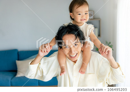 Dad holding a baby 106495203