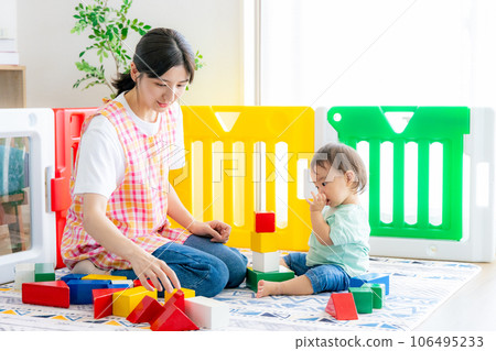 Nursery teacher and children playing with toys 106495233