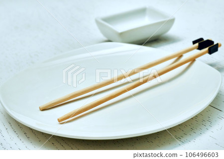 Bonded chopsticks for the inept. Oriental food, sushi, plate, gravy bowl Bonded chopsticks for the inept. Oriental food, sushi, plate, gravy bowl 106496603